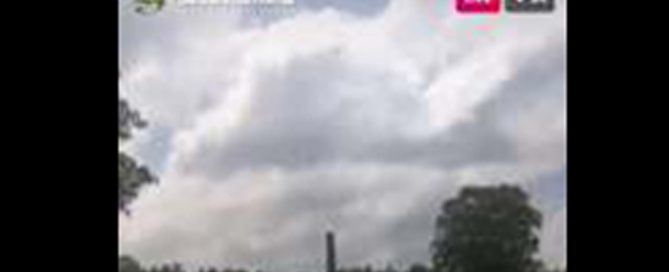 A blurry print screen of an instagram live tour. A cloudy sky with part of the memorial grounds in the background.