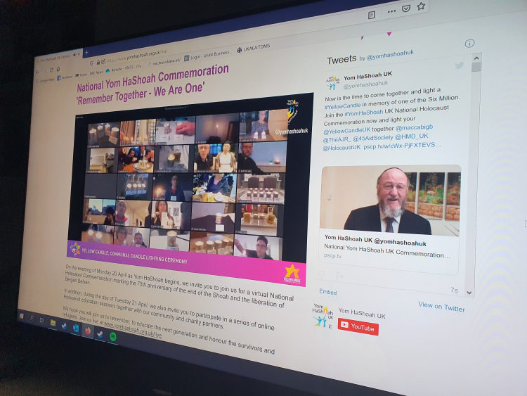 Screenshot of the YomHaShoah website showing a Zoom screen with several people lighting candles.