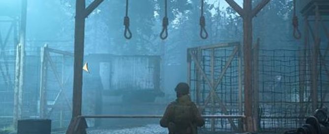 Screenshot from *Call of Duty* game showing a soldier in a grim, foggy environment with hanging nooses and fencing, text reads: "Pierson: Daniels, over here."